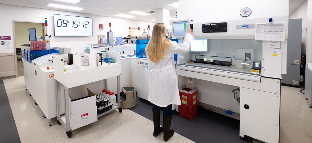 Woman working in the lab at UC Health in Cincinnati, OH.