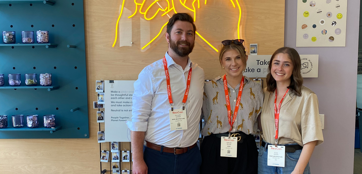 Three BHDP employees pose for a photo at NeoCon 2024