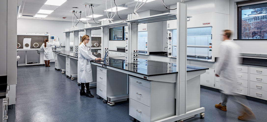 Mobile, flexible casework with ceiling-mounted utility panels supports the ability of a research lab to change quickly to address adjustments in research objectives and the incorporation of new equipment.