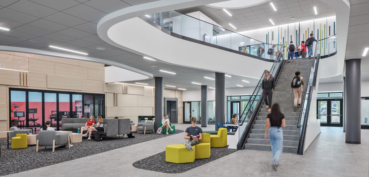 Student utilizing the lobby of Miami University's McVey Data Science Building