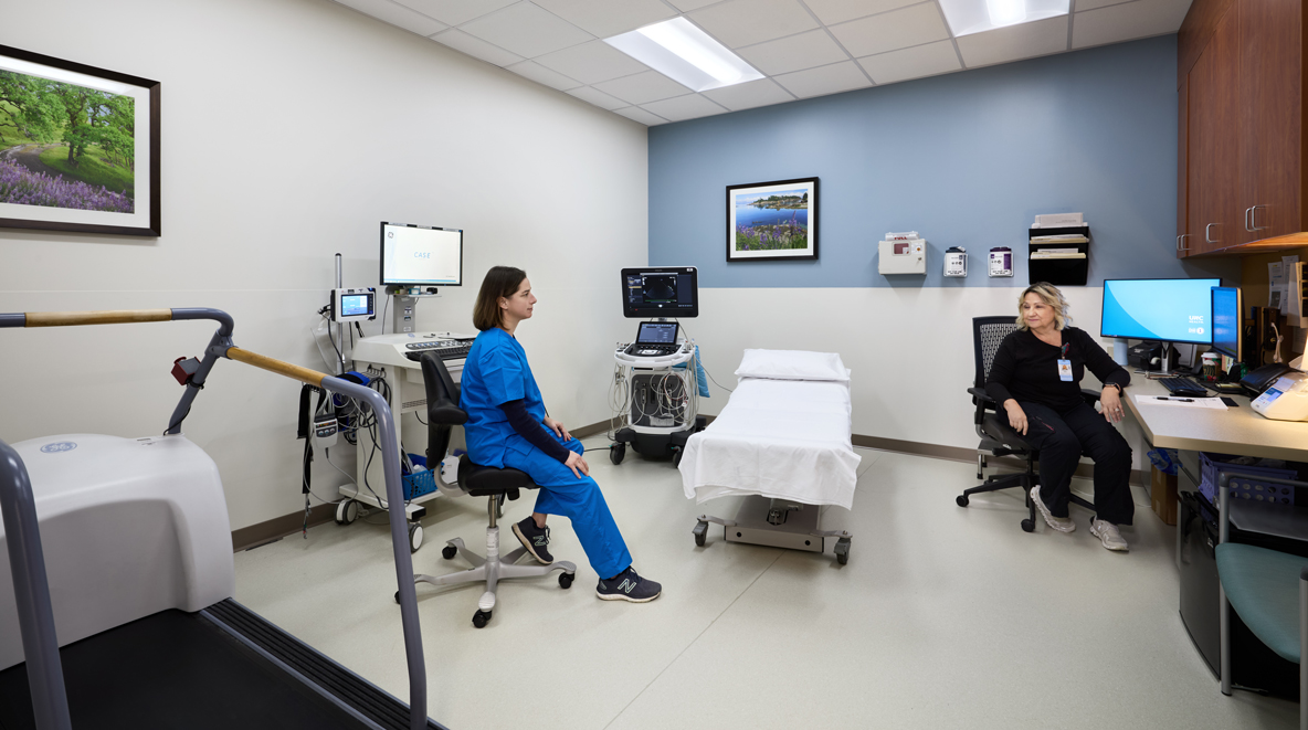 Two providers talk in one of the ultrasound, echo, and procedure rooms