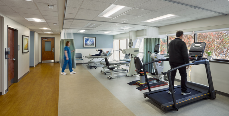 Patients use different equipment in the rehab area