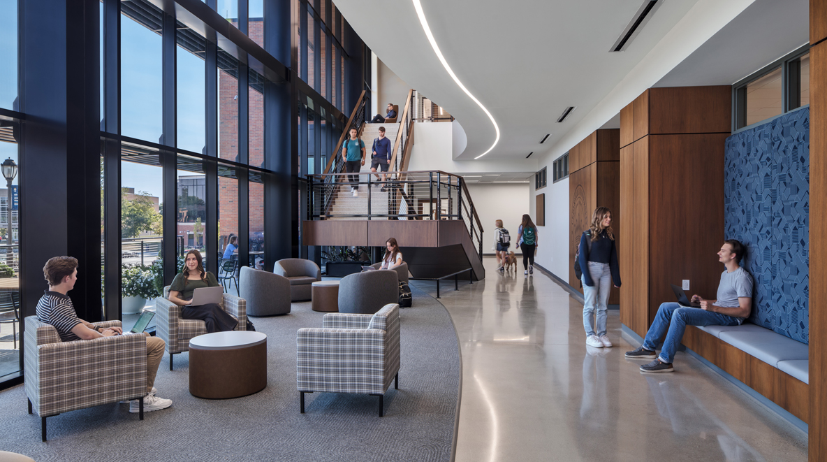 An open collaboration zone with a central staircase inside the Scharnberg Business and Communication Center