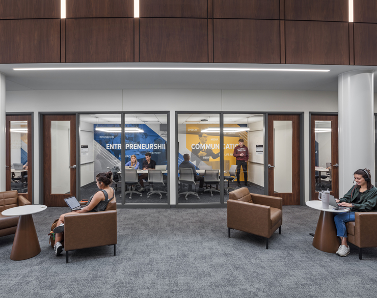 Some students work out in an open commons area while others use semi-private study rooms