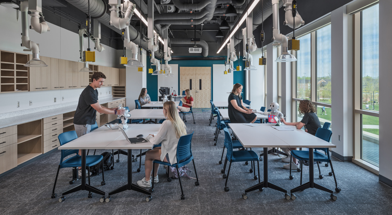 Students collaborate in a robotics lab