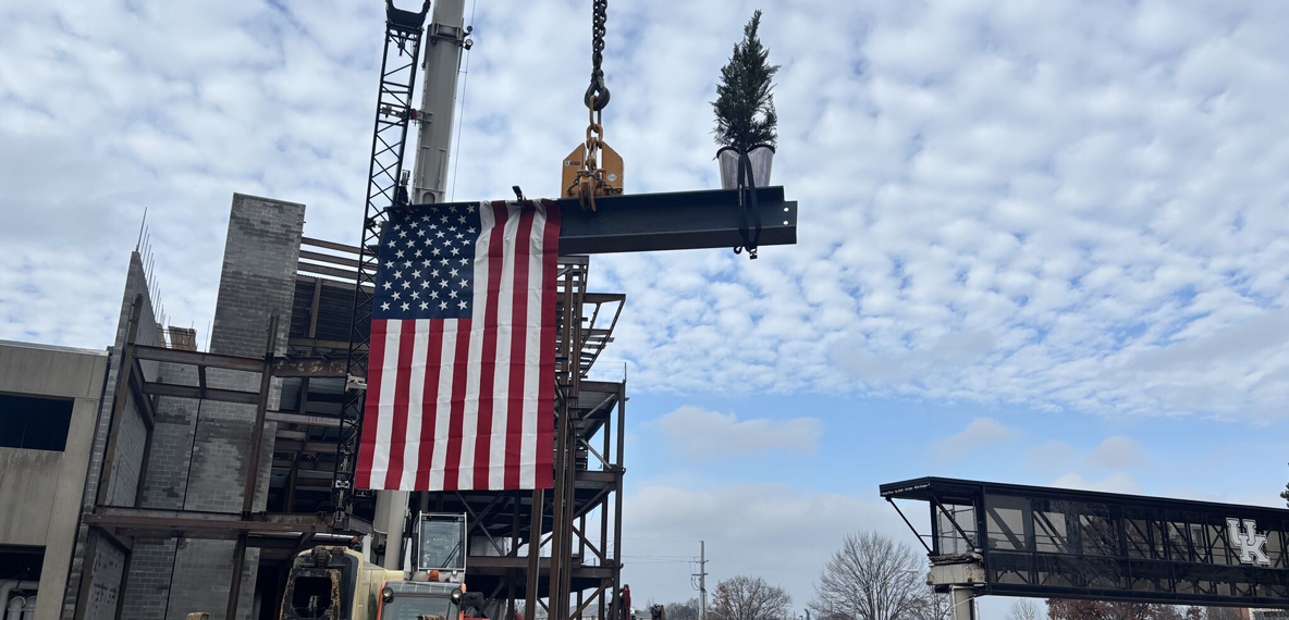 A beam is lifted up during the topping out ceremony